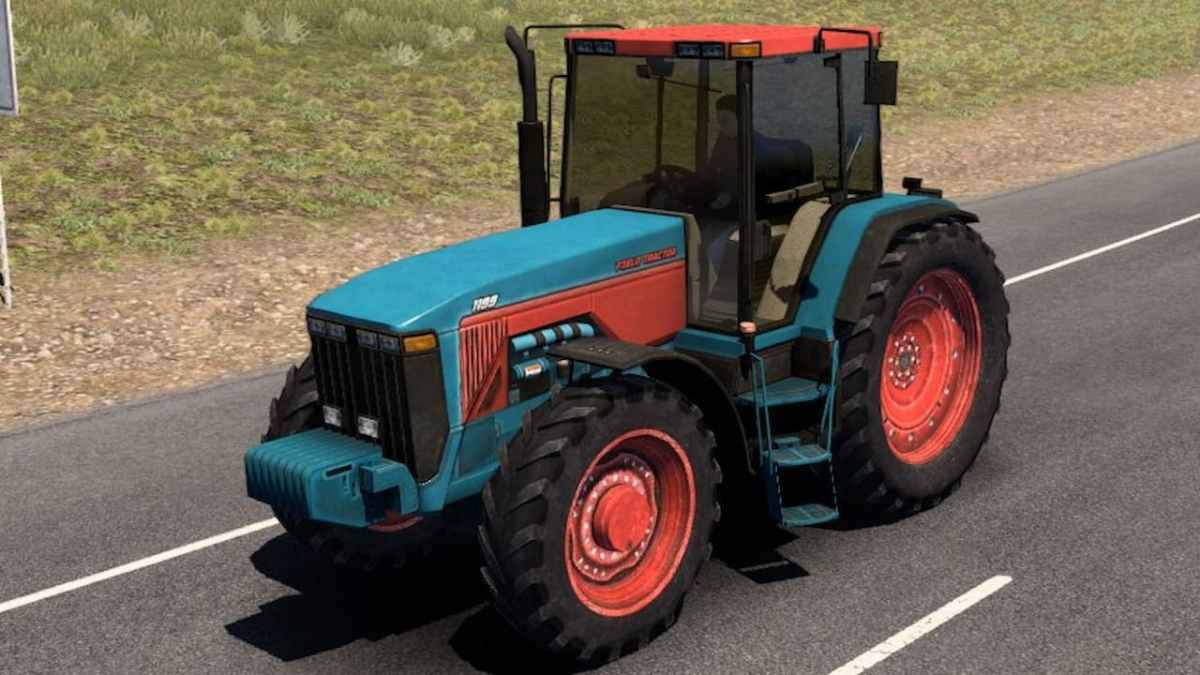 A tractor modded into American Truck Simulator, driving down a road.